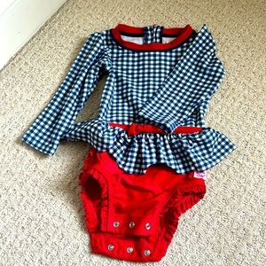 Ruffle Butts blue and white checked/red one-piece rash guard swimsuit. 12-18 m